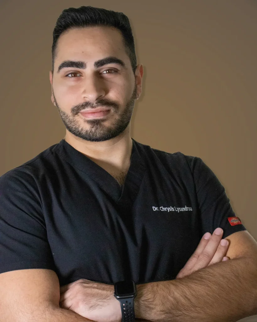 A headshot of Dr. Chrysis Lysandrou, the best dentist in Limassol